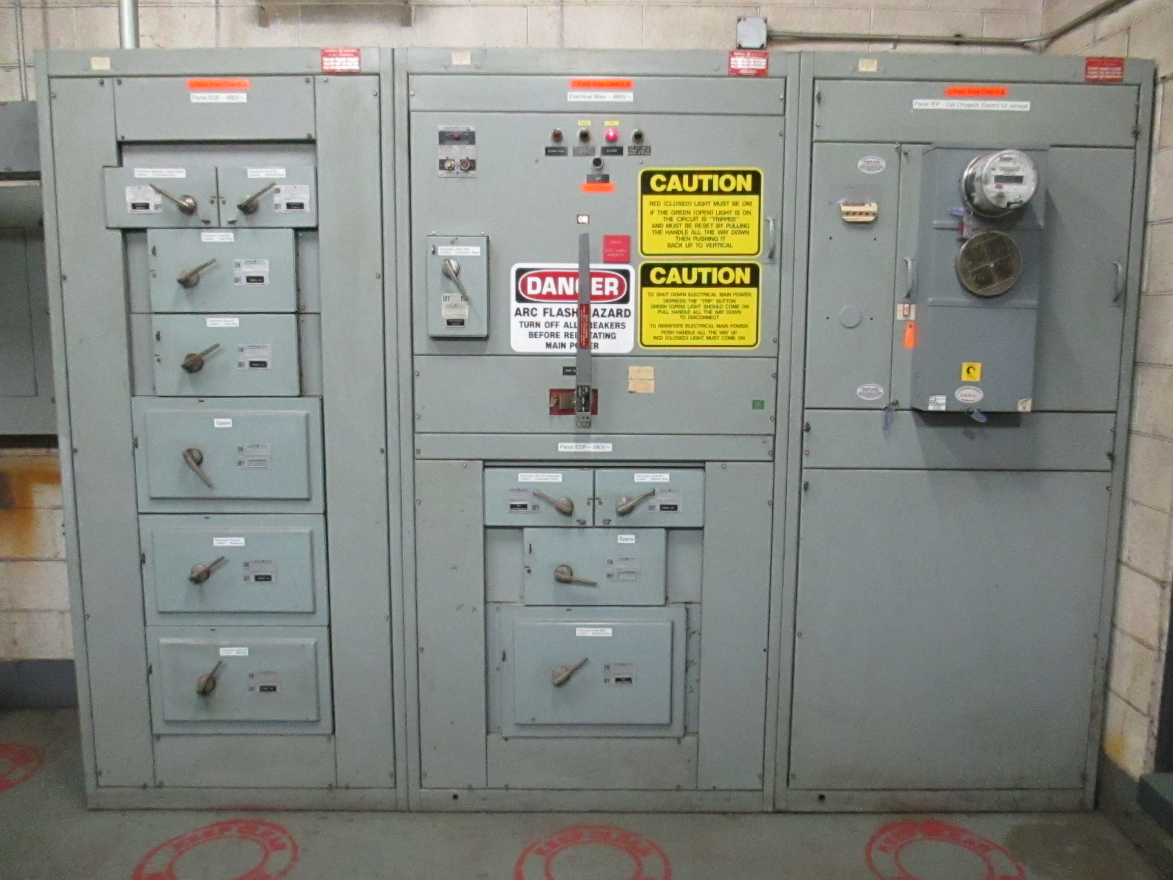 Commercial 480-volt main and distribution switchgear in an electrical room